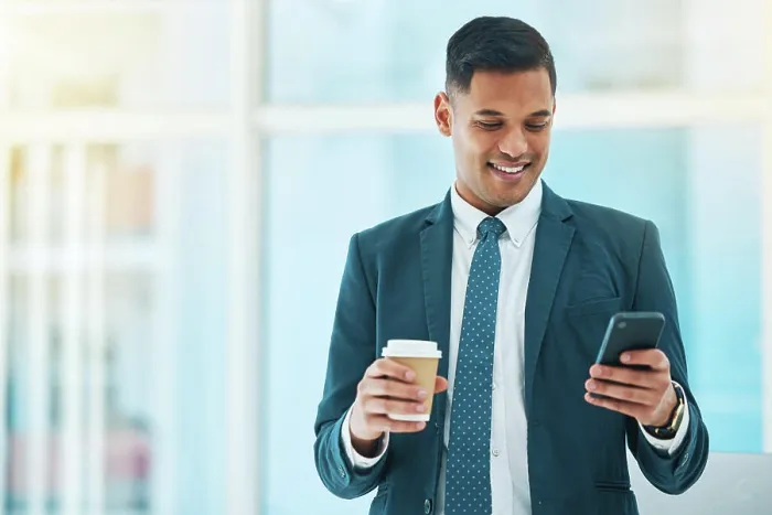 Framed Print : Cellphone, coffee and business man in office online for social media Framed Print : Cellphone, coffee and business man in office online for social media