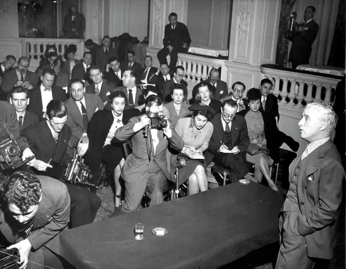 Framed Print : Chaplin Talks - Reporters and cameramen crowd the floor of the hotel ballroom and are draped over the balcony Framed Print : Chaplin Talks - Reporters and cameramen crowd the floor of the hotel ballroom and are draped over the balcony