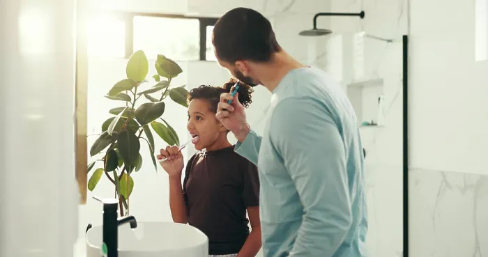 Framed Print : Child, dad and brushing teeth in bathroom for dental hygiene or morning routine together in home Framed Print : Child, dad and brushing teeth in bathroom for dental hygiene or morning routine together in home