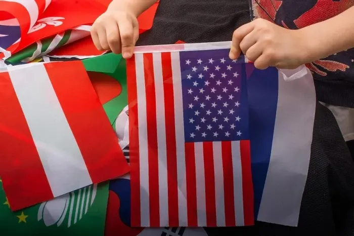Framed Print : Child hand holding an American flag in hand