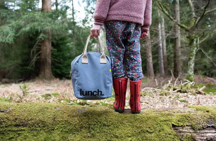 Framed Print : child holding onto a picnic lunch bag whilst walking in the forest Framed Print : child holding onto a picnic lunch bag whilst walking in the forest