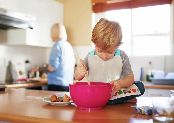 Framed Print : Child mixing, mom and baking together in kitchen for development