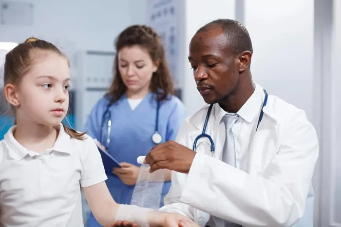 Framed Print : Child being treated by doctor and nurse Framed Print : Child being treated by doctor and nurse