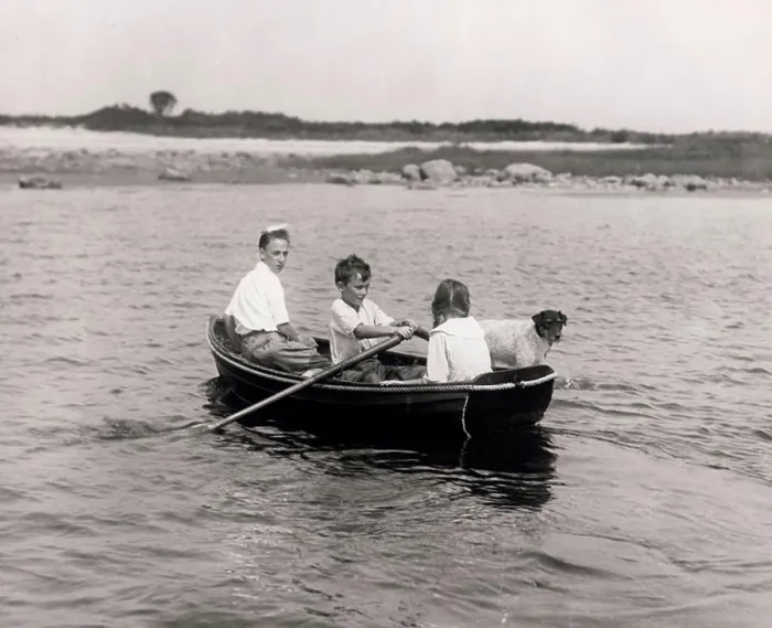 Framed Print : Three children with dog sitting in rowing boat