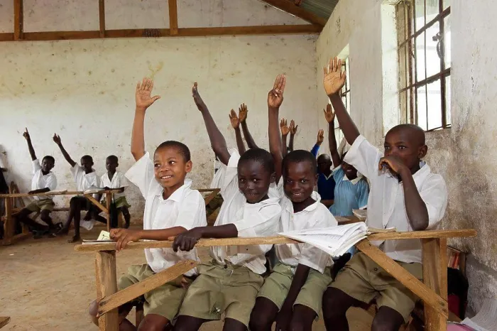 Framed Print : Children with hands up in classroom at rural school, Kenya, June Framed Print : Children with hands up in classroom at rural school, Kenya, June