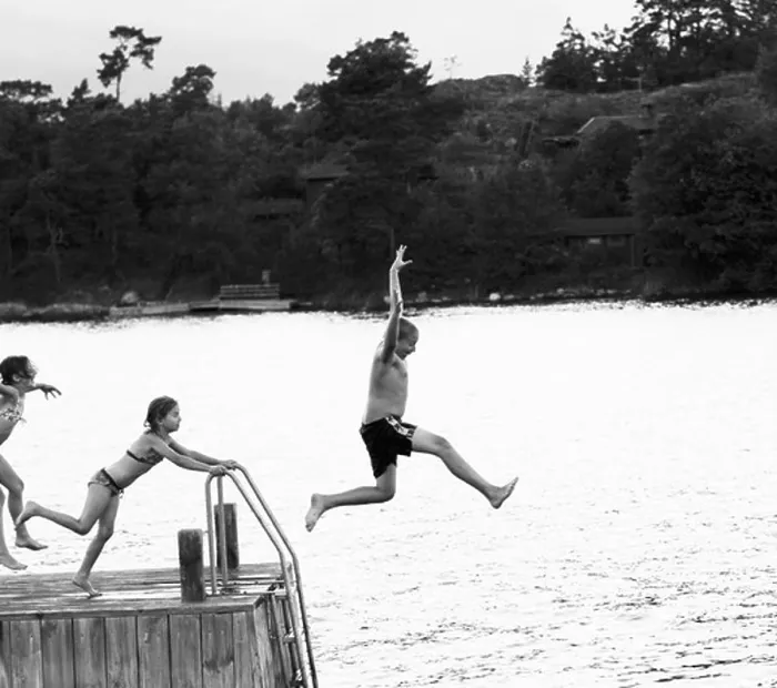 Framed Print : Three children jumping from a jetty, Sweden