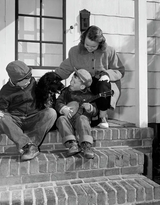 Framed Print : Children sitting with dog on steps