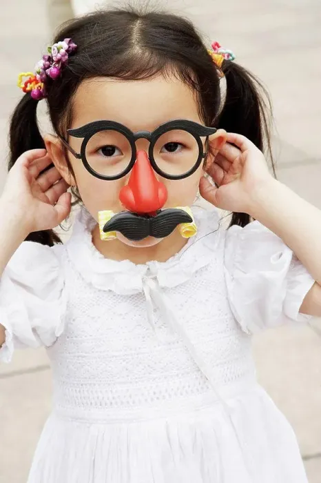 Framed Print : Chinese girl wearing mask with eyeglasses and mustache Framed Print : Chinese girl wearing mask with eyeglasses and mustache