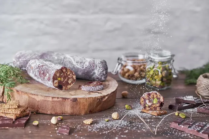 Framed Print : Chocolate salami with nuts on wooden table
