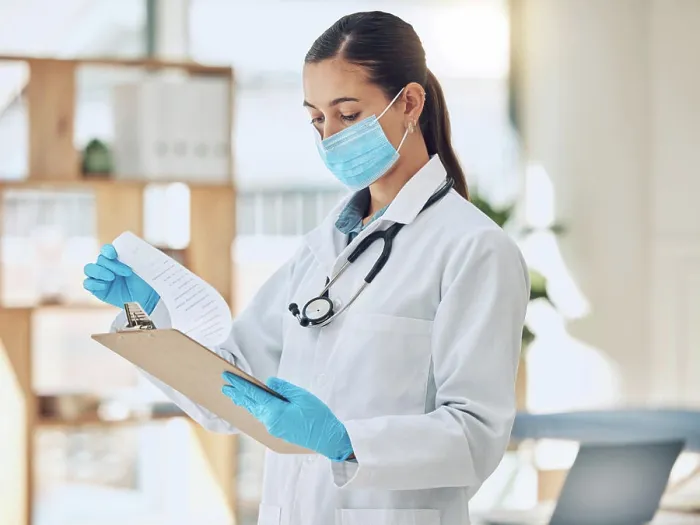 Framed Print : Clipboard, face mask and doctor in office at hospital with research for viral disease diagnosis