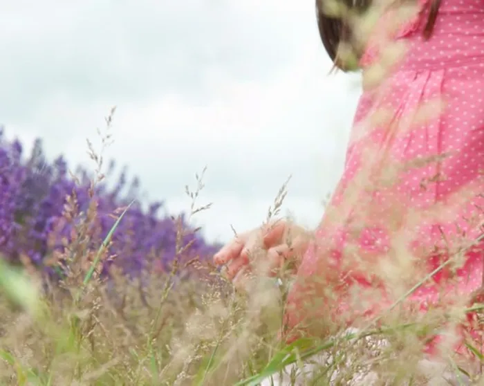 Framed Print : Close up of girl in field of flowers
