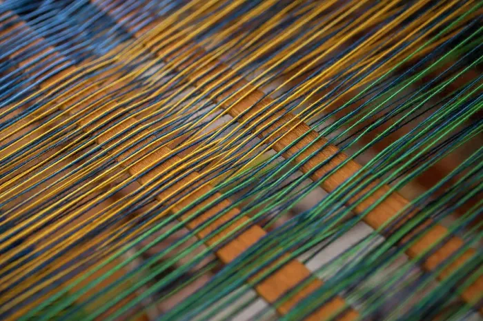 Framed Print : Close up green and yellow thread on loom Framed Print : Close up green and yellow thread on loom