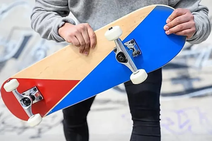 Framed Print : Close up of unrecognizable young man holding longboard or skateboard in the park Framed Print : Close up of unrecognizable young man holding longboard or skateboard in the park