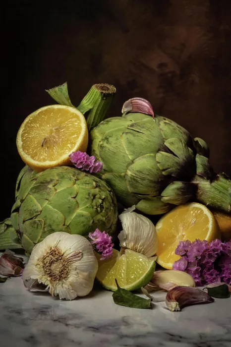 Framed Print : Close-up of artichokes, garlic, lemons and flowers on table Framed Print : Close-up of artichokes, garlic, lemons and flowers on table