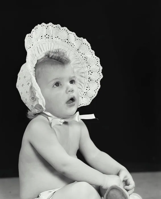 Framed Print : Close-up of a baby girl wearing a bonnet