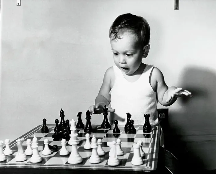 Framed Print : Close-up of a boy playing chess Framed Print : Close-up of a boy playing chess