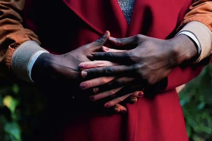 Framed Print : Close-up of couple holding hands Framed Print : Close-up of couple holding hands