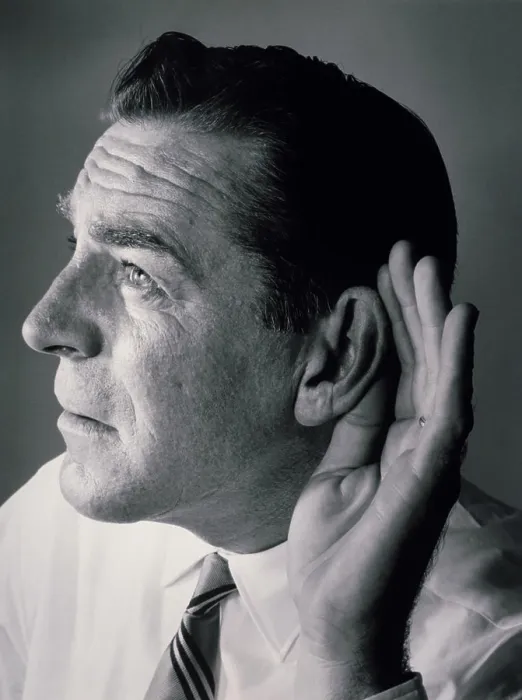 Framed Print : Close-up of a mature man with a cupped hand to his ear Framed Print : Close-up of a mature man with a cupped hand to his ear