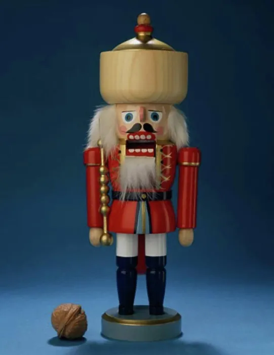 Framed Print : Close-up of a nutcracker with a walnut beside it Framed Print : Close-up of a nutcracker with a walnut beside it