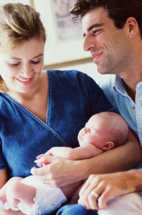 Framed Print : Close-up of parents holding their son
