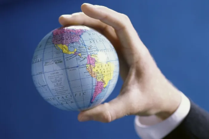 Framed Print : Close-up of a person's hands holding a globe