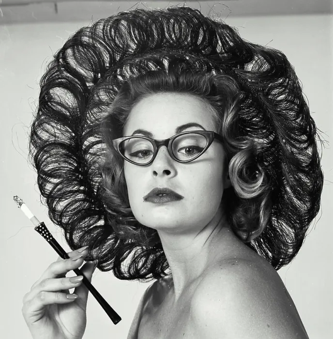 Framed Print : Close-up of a young woman holding a cigarette holder Framed Print : Close-up of a young woman holding a cigarette holder