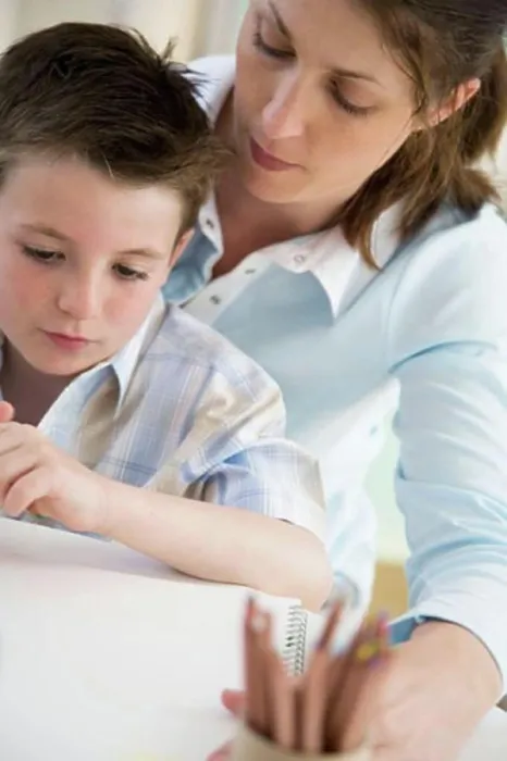 Framed Print : Close-up of a young woman teaching her son to draw Framed Print : Close-up of a young woman teaching her son to draw