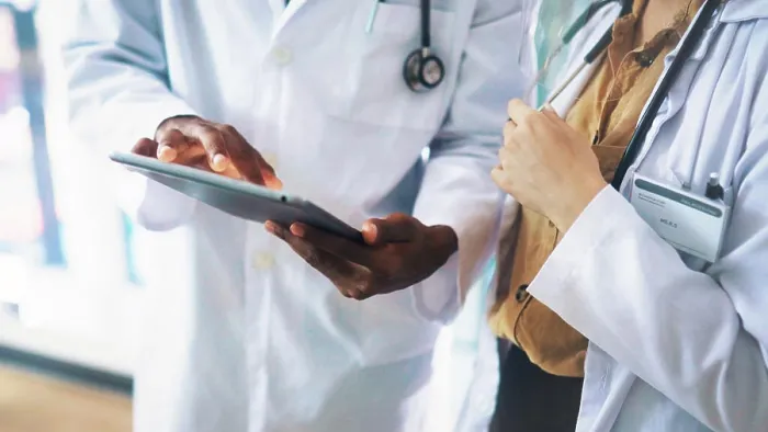 Framed Print : Collaboration, hands and tablet with doctors in hospital together for medical consulting Framed Print : Collaboration, hands and tablet with doctors in hospital together for medical consulting