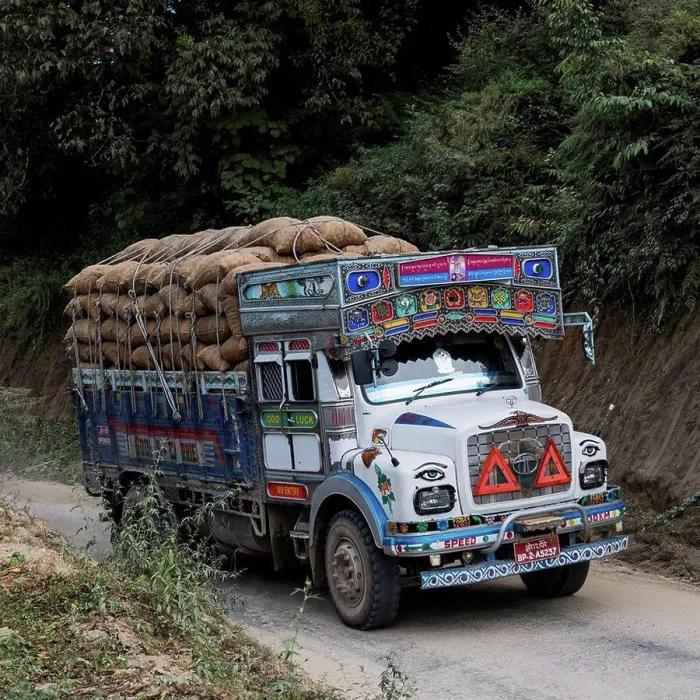 Framed Print : A colourful truck loaded with brown sacks; Thimphu, Bhutan Framed Print : A colourful truck loaded with brown sacks; Thimphu, Bhutan