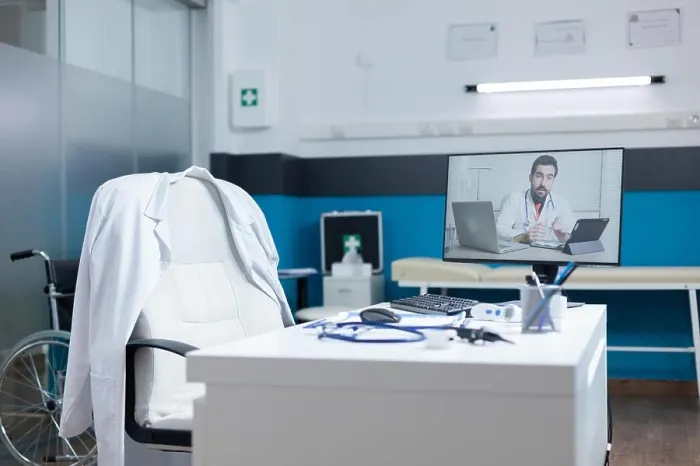 Framed Print : Computer with remote doctor having online telework videocall Framed Print : Computer with remote doctor having online telework videocall