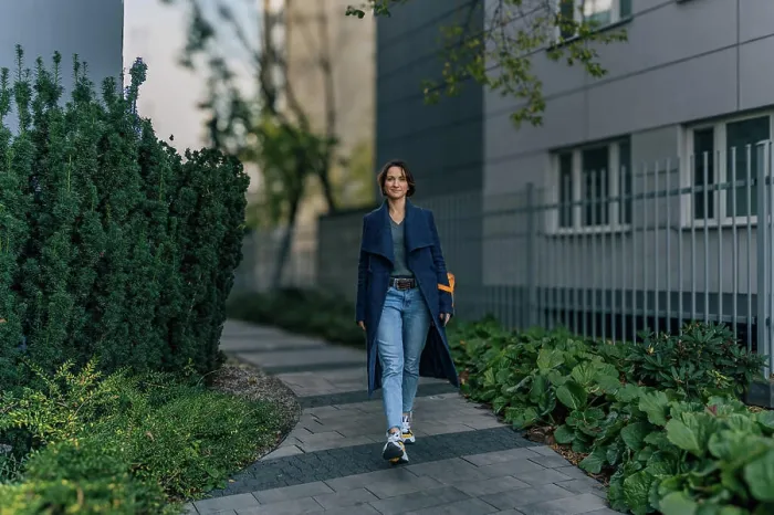 Framed Print : Confident young woman enjoying a walk in an urban neighborhood Framed Print : Confident young woman enjoying a walk in an urban neighborhood