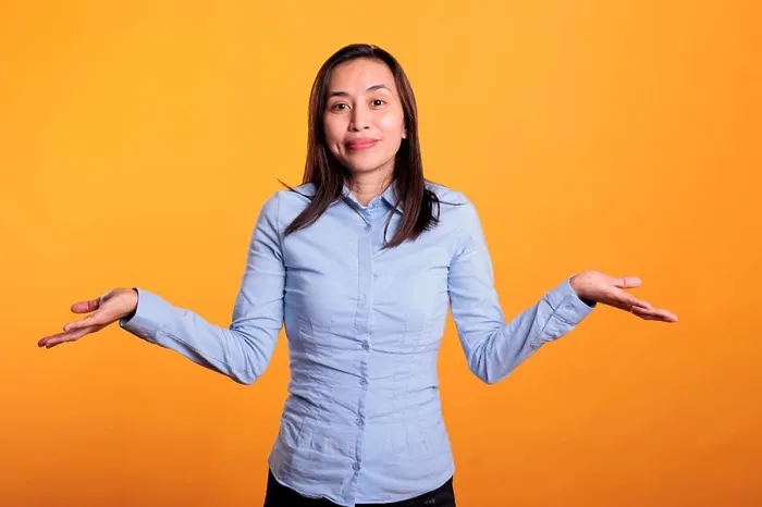 Framed Print : Confused asian woman being hesitant and unconfident Framed Print : Confused asian woman being hesitant and unconfident