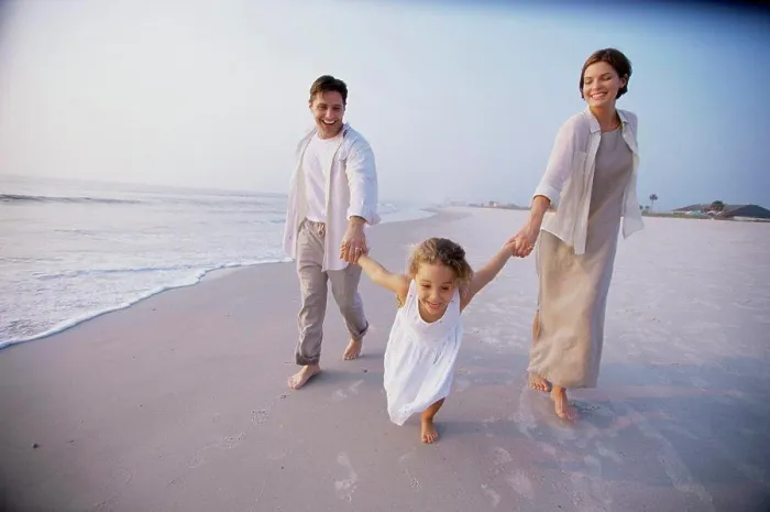 Framed Print : Couple with their daughter on the beach Framed Print : Couple with their daughter on the beach