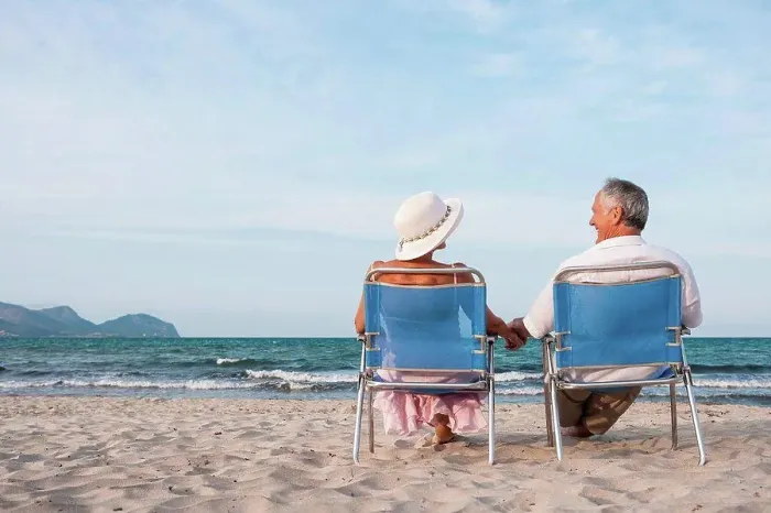Framed Print : Couple on deckchairs on beach, Palma de Mallorca, Spain Framed Print : Couple on deckchairs on beach, Palma de Mallorca, Spain