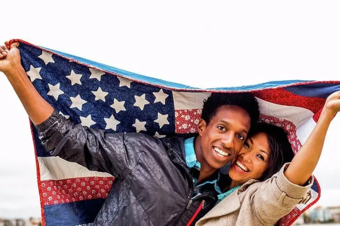 Framed Print : Couple holding American flag quilt outdoors Framed Print : Couple holding American flag quilt outdoors