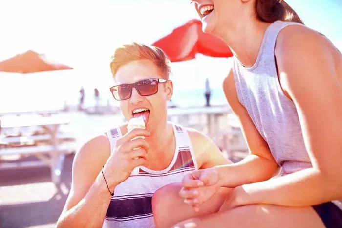 Framed Print : Couple with ice cream smiling Framed Print : Couple with ice cream smiling