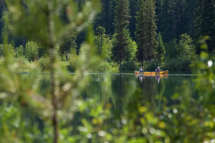 Framed Print : A couple paddle a yellow canoe across Unna Lake in Bowron Lake Provincial Park Framed Print : A couple paddle a yellow canoe across Unna Lake in Bowron Lake Provincial Park
