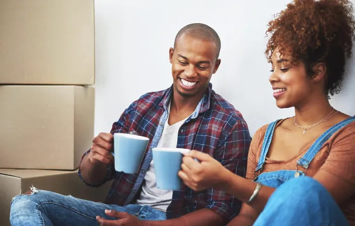 Framed Print : Couple, smile and coffee in new house with boxes for moving Framed Print : Couple, smile and coffee in new house with boxes for moving