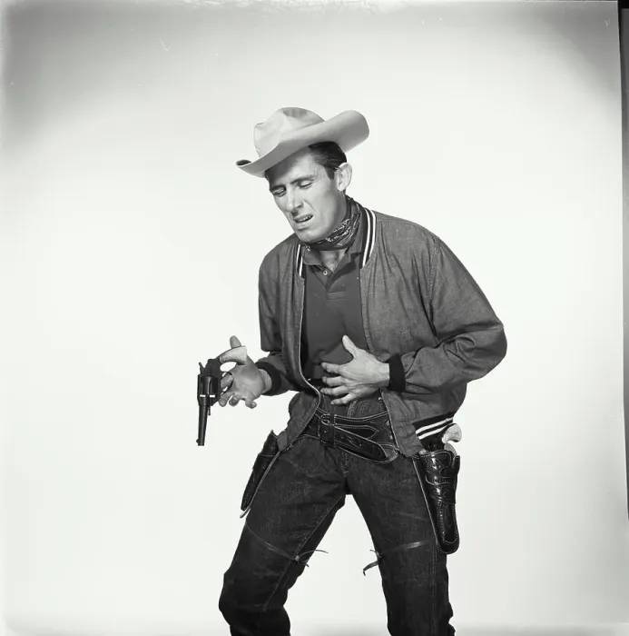 Framed Print : Cowboy pretending to be shot