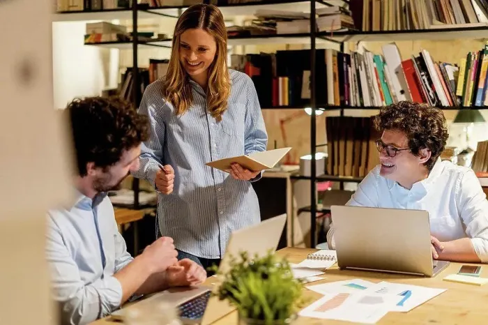 Framed Print : Coworkers working at desk in office Framed Print : Coworkers working at desk in office