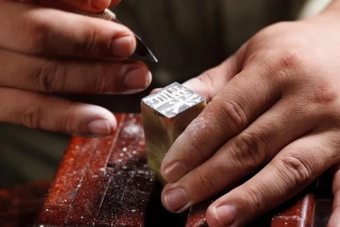 Framed Print : Craftsman carving Chinese character into a Chinese chop Framed Print : Craftsman carving Chinese character into a Chinese chop