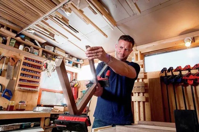 Framed Print : Craftsman preparing parts for wooden object Framed Print : Craftsman preparing parts for wooden object
