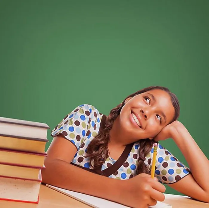 Framed Print : Cute hispanic girl studying and looking up to blank chalk board Framed Print : Cute hispanic girl studying and looking up to blank chalk board