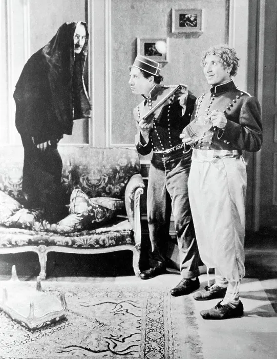 Framed Print : A Day At The Races'. Groucho in disguise eludes Chico with tray and Harpo with seltzer Framed Print : A Day At The Races'. Groucho in disguise eludes Chico with tray and Harpo with seltzer