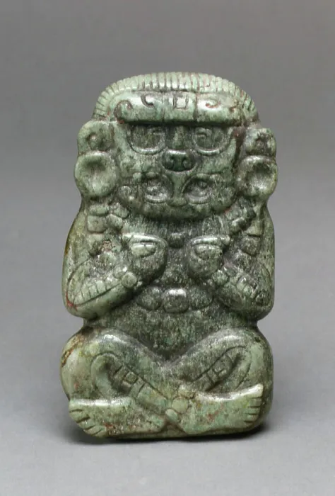 Framed Print : Deity Figure 3rd-6th century Maya This jade figurine depicts a cross-legged figure with his arms bent in toward his