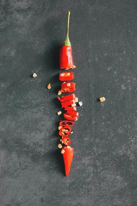 Framed Print : Directly above shot of chopped red chili pepper on table