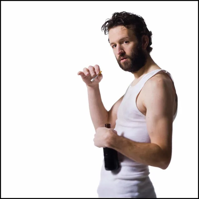 Framed Print : Disheveled man with cigarette and beer bottle