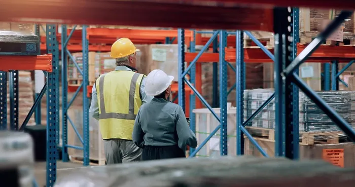Framed Print : Distribution, man and woman walking in warehouse for logistics Framed Print : Distribution, man and woman walking in warehouse for logistics
