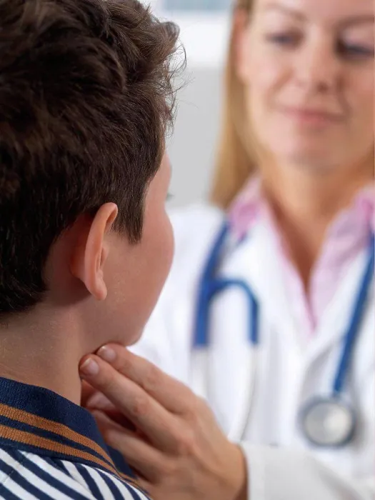Framed Print : Doctor checking 10 year old boys glands as part of a medical examination Framed Print : Doctor checking 10 year old boys glands as part of a medical examination