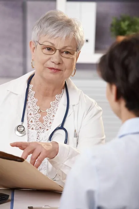 Framed Print : Doctor explaining to patient Smiling senior doctor explaining results to patient in office Framed Print : Doctor explaining to patient Smiling senior doctor explaining results to patient in office